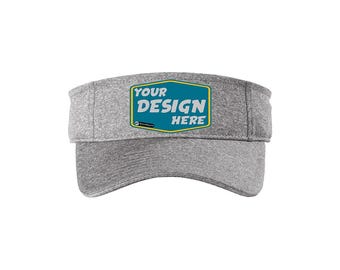 Könnte beinhalten: Graue Sportvisier mit einem blauen und gelben rechteckigen Patch, auf dem "YOUR DESIGN HERE" steht.
