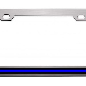 May include: A silver metal license plate frame with a thin blue stripe across the bottom.