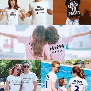 May include: Collection of white t-shirts with various printed phrases. One shirt says "Just Married" with an arrow, another says "Get Ready to Party." Other shirts have "FRIEND FOREVER," "I'm His Queen," and "I'm her King" printed on them.