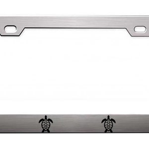 May include: A silver metal license plate frame with four black turtle silhouettes on the bottom edge.