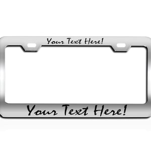 May include: Silver license plate frame with the text "Your Text Here!" on the top and bottom.