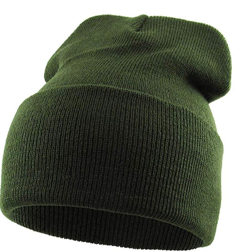 May include: A dark green knitted beanie hat. The hat is folded down at the top and has a ribbed texture.