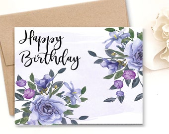 May include: A white card with a watercolor background and purple and blue flowers. The card says "Happy Birthday" in black cursive.
