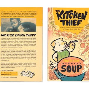 Puede incluir: Un fanzine de cocina titulado "The Kitchen Thief" con un perro de dibujos animados en la portada, sosteniendo una cuchara sobre un cuenco de sopa. La contraportada presenta texto sobre la cocina birmana y una foto. El fanzine es un libro de cocina de padre e hija.