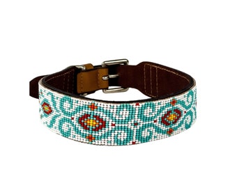 May include: A brown leather dog collar with a turquoise, white, red, and yellow beaded design.