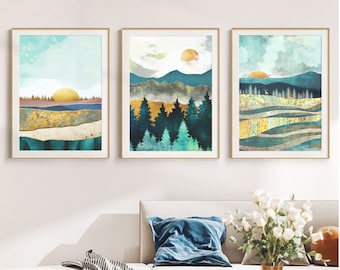 May include: Three abstract landscape paintings with a gold, blue, and green color scheme. The paintings depict a mountain range, a forest, and a field with a sun in the sky.