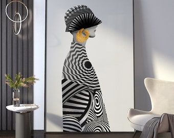 May include: Black and white abstract art print featuring a woman wearing a hat and a large gold earring. The print is framed in a black frame and is hanging on a white wall.
