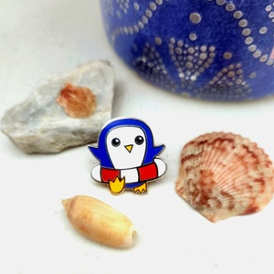 Beach floaty penguin hard enamel pin