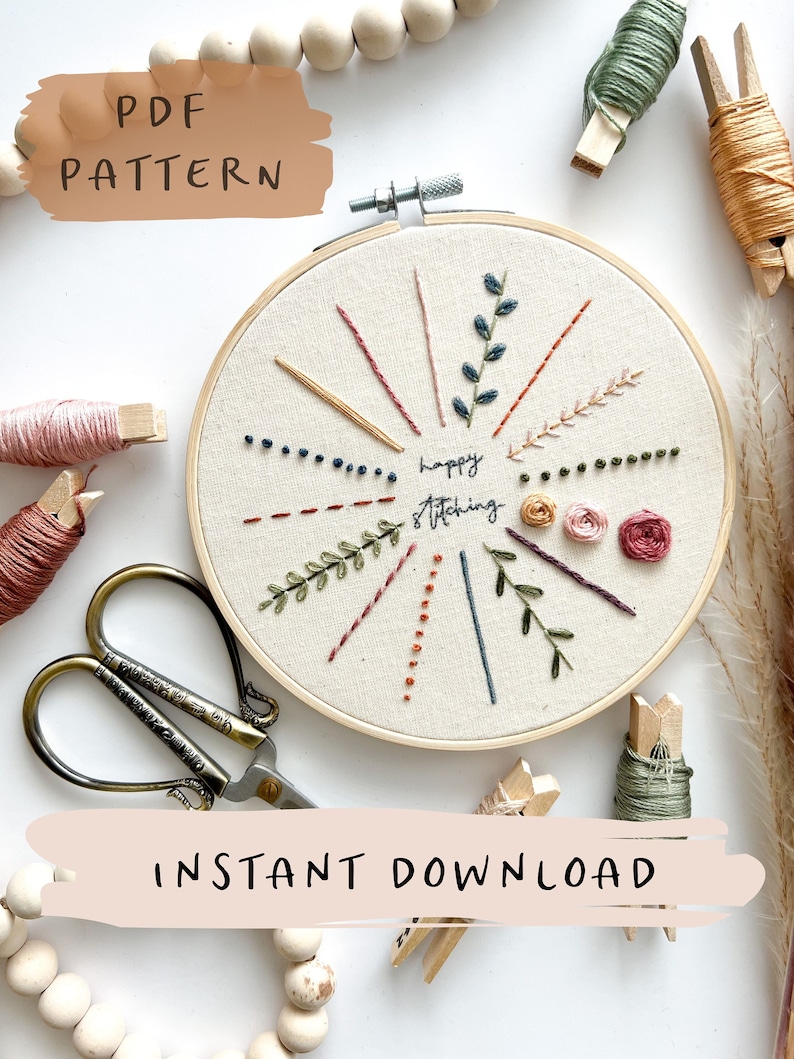 May include: A PDF pattern for a hoop embroidery project with the text "happy stitching". The pattern includes a variety of stitches, including straight stitches, French knots, and backstitch. The pattern is surrounded by wooden beads, embroidery floss, and embroidery hoops.
