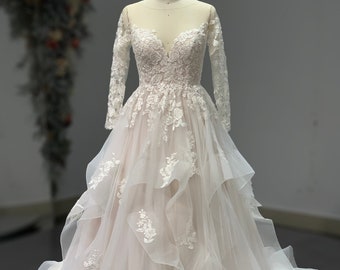 Stunning Long Sleeves, Ruffle Tiered Lace Ball gown wedding Dress. Also available in Black and Red color.