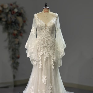 Stunning long Bell Sleeves Mermaid All-over Lace Wedding Dress. Also available in Black and Red color.