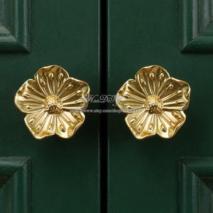 May include: A set of three ceramic mugs with a speckled, matte finish in cream, light brown, and dark brown. Each mug features a minimalist design, ideal for tea or coffee.