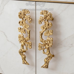 May include: A set of three ceramic mugs with a speckled, matte finish. Each mug features a different color: light blue, cream, and gray. The mugs have a simple, modern design and a comfortable handle.