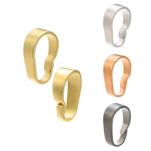 May include: Four pendant bails in different metal finishes: silver, gold, rose gold, and gunmetal. Each bail is a simple, smooth, oval shape with a flat top and a rounded bottom.