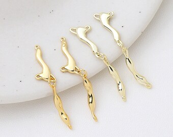 May include: Four gold-toned metal connectors with a twisted design. The connectors have a loop on one end and a hook on the other end.