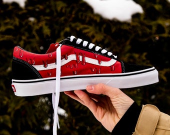 black and white checkered vans with red drip