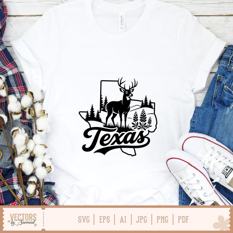 May include: White t-shirt featuring a black graphic of the state of Texas with a deer, trees, and the word "Texas" in a stylized font. The shirt is paired with blue jeans and white sneakers.