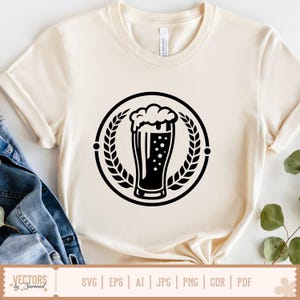 May include: Cream-colored t-shirt featuring a black graphic of a beer glass with foam, inside a circular wreath. The shirt has short sleeves and a crew neck. The bottom of the shirt shows the text "SVG | EPS | AI | JPG | PNG | GDR | PDF".