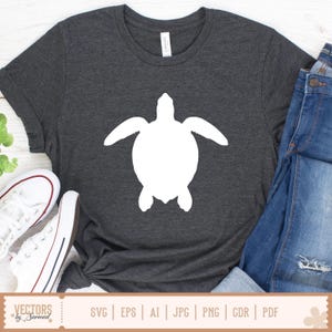 May include: Dark gray t-shirt featuring a large white sea turtle silhouette. The shirt is paired with blue jeans and white sneakers. The bottom of the image includes the text "VECTORS by Sarmad" and file type options.