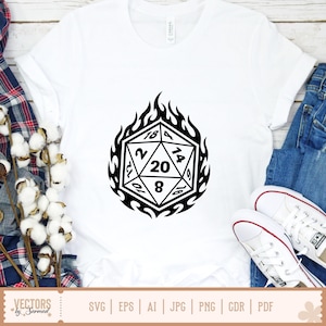 May include: White t-shirt with a black D20 die graphic encircled by flames. The die displays numbers 2, 8, 10, 12, 14, 16, 18, and 20. The shirt is styled with blue jeans and white trainers.