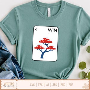 May include: A light green t-shirt featuring a graphic of a card with the number 4 and the word WIN. The card design includes a blue tree with red, snow-capped mushroom-like shapes. The shirt also has the text "VECTORS by Sarmad" and file type icons.