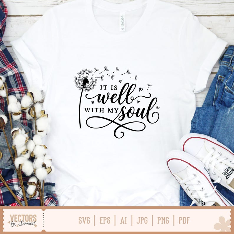 Puede incluir: Camiseta blanca con un dise&ntilde;o de diente de le&oacute;n negro y la frase "IT IS well WITH MY soul" en una elegante escritura. El dise&ntilde;o incluye peque&ntilde;os acentos de coraz&oacute;n. La camiseta se muestra con vaqueros azules y zapatillas blancas.
