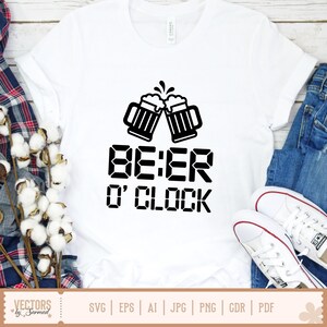 May include: White t-shirt with a black graphic of two beer mugs clinking, above the text "BE:ER O' CLOCK". The shirt is paired with blue jeans and white sneakers. The bottom of the shirt has the text "SVG | EPS | AI | JPG | PNG | CDR | PDF".