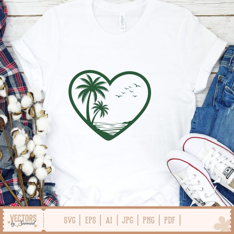 Op de afbeelding: Wit T-shirt met een groen hartvormig ontwerp met palmbomen, oceaan en vogels. Het shirt heeft een ronde hals en korte mouwen. De onderkant van het shirt heeft de tekst "VECTORS by Sarmad" en bestandstype-opties.