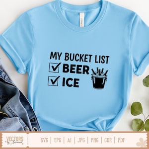 May include: Light blue t-shirt with the text "MY BUCKET LIST" and check boxes next to "BEER" and "ICE". A black bucket with beer bottles is also shown. The shirt has rolled-up sleeves.