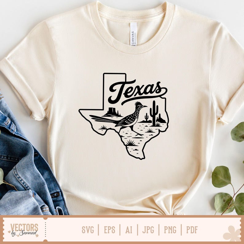 May include: Cream-colored t-shirt featuring a black graphic of the state of Texas with a roadrunner, cactus, and the word "Texas" in a script font. The shirt is made of a soft material.