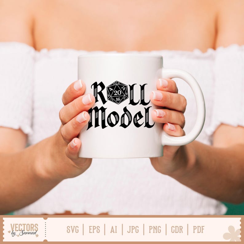May include: A white ceramic mug featuring the text "Roll Model" in a gothic font, with a black and white D20 die graphic. The mug is held by a person wearing a white off-the-shoulder top. The mug is a standard size.