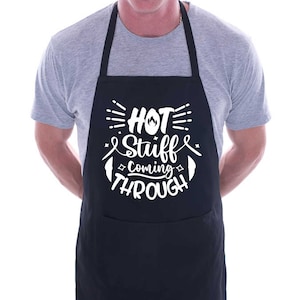 May include: Black apron with a white graphic that says "Hot Stuff Coming Through" with a flame symbol.