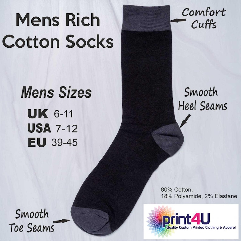 May include: Black and gray men's cotton socks with "Comfort Cuffs" and "Smooth Heel Seams." The socks are available in sizes UK 6-11, USA 7-12, and EU 39-45. The socks are made of 80% cotton, 18% polyamide, and 2% elastane.