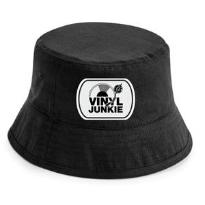 May include: Black bucket hat with a white and black graphic patch. The patch features a turntable design and the words "VINYL JUNKIE" in bold, black letters. The hat is made of a soft, durable fabric.