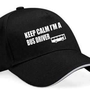 May include: Black baseball cap with a white embroidered design that says "Keep Calm I'm A Bus Driver" and a small bus icon.