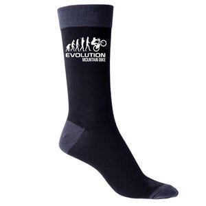 May include: Black socks with gray accents at the toe, heel, and cuff. The socks feature a white graphic of the evolution of mountain biking, with the text "EVOLUTION MOUNTAIN BIKE" below the graphic.