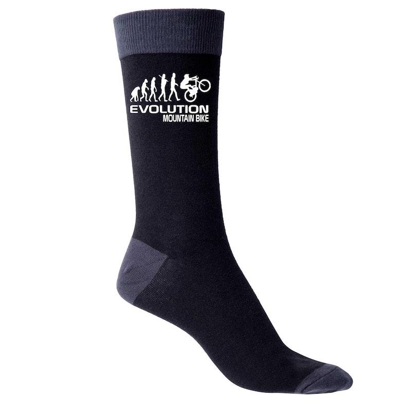 May include: Black socks with gray accents at the toe, heel, and cuff. The socks feature a white graphic of the evolution of mountain biking, with the text "EVOLUTION MOUNTAIN BIKE" below the graphic.
