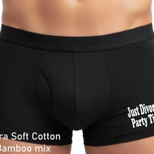 May include: Black boxer briefs featuring a wide elastic waistband with the word ALPHA embossed. The front leg displays the white text Just Divorced Party Time! and the bottom left corner includes the white text Ultra Soft Cotton Bamboo mix.