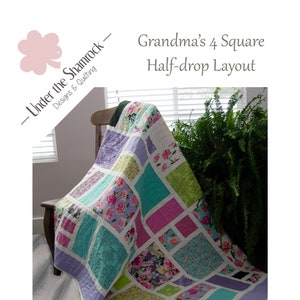 May include: A quilt with a "Grandma's 4 Square Half-drop Layout" design. The quilt is made of various floral fabrics in shades of pink, purple, green, and blue. The quilt is draped over a chair and has a light purple border.