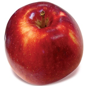 May include: A close-up of a ripe red apple with a short stem. The apple has a smooth, shiny surface with subtle variations in color, ranging from deep red to lighter shades. Small white dots are scattered across the skin.