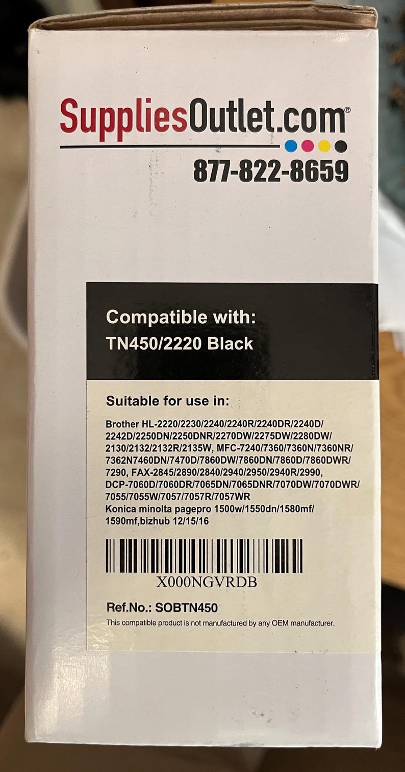 May include: A white box with the SuppliesOutlet.com logo and phone number. The box is labeled "Compatible with: TN450/2220 Black" and lists compatible printer models. The product is not manufactured by any OEM manufacturer.