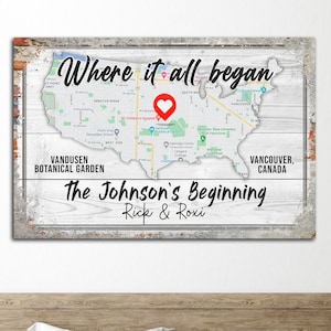 May include: A white wooden sign with a map of the United States, a red heart marking a location, and the text "Where it all began". Below the map is the text "The Johnson's Beginning, Rick & Roxi".
