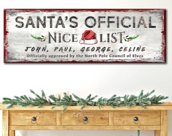 May include: A white wooden sign with red trim reads "SANTA'S OFFICIAL NICE LIST" with a red Santa hat and holly sprigs. The names "JOHN, PAUL, GEORGE, CELINE" are listed below the sign. The text "Officially approved by the North Pole Council of Elves" is at the bottom of the sign.