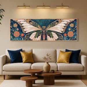 May include: A rectangular wall art piece featuring a detailed butterfly design with teal, cream, and green hues. The artwork is framed and includes floral accents in orange and gold. The piece hangs above a beige sofa with navy and gold throw pillows.