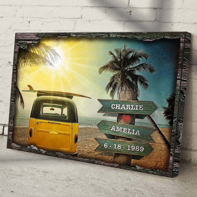 May include: A yellow vintage van with a surfboard on top is parked on a beach with palm trees. Wooden signs with the names "Charlie", "Amelia", and the date "6-18-1989" are attached to a post.