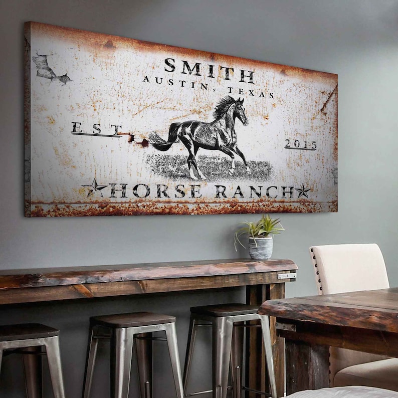 May include: Rustic metal sign with a white background and brown rust accents. The sign features the text "SMITH AUSTIN, TEXAS EST. 2015 HORSE RANCH" and a black and white silhouette of a horse running.