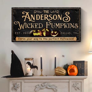 May include: A black and brown wooden sign with the text "The Andersons Wicked Pumpkins Est. 2020 Dallas, TX Carve your way to the perfect Halloween!" and three jack-o'-lantern faces.