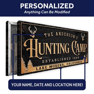 May include: Personalized wooden sign with a black background and gold lettering. The sign reads "The Anderson's Hunting Camp Established 1996 Lake Morena, California".