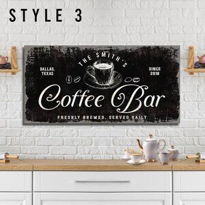 May include: Black and white sign with the text "The Smith's Coffee Bar" in a vintage style font. The sign also includes the text "Dallas, Texas" and "Since 2018".