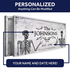May include: A personalized Halloween-themed canvas print featuring two skeletons with a banner that reads "The Johnsons Est. 1990". The background is a distressed white with black spiderwebs.